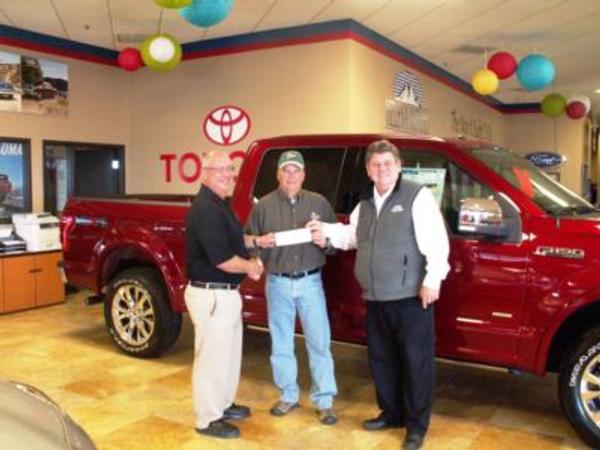 Dan Prebil, co-owner of Kleen King/Dayspring Restoration, and Todd Gilbreath, sales person for Helena Motors accepts a $1,200 check from Randy Piearson, president of the Headwaters Chapter on behalf of the the Kelly Kuntz College Scholarship Fund. The Headweaters Chapter auctioned a bronze statue at it's 2015 fund-raising banquet and proudly donated one half of the proceeds to the scholarship fund.